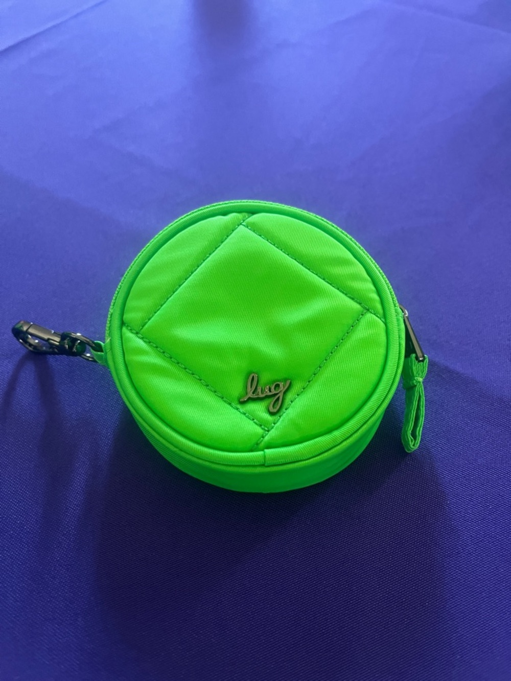Lug Lime Green Quilted Circle Coin Pouch with floral interior.